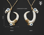 Detailed back view of the hand-carved Maori fish hook pendant showcasing the intricate bone carving