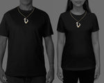 Maori Hei Matau bone pendant necklace worn on an adjustable cord woven from natural flax fibers
