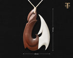 Detailed view of the hand-carved wood texture on the Hawaiian Makau necklace with measurements 