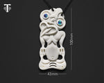 Medium-sized Maori bone Hei Tiki pendant from New Zealand displayed to show its dimensions