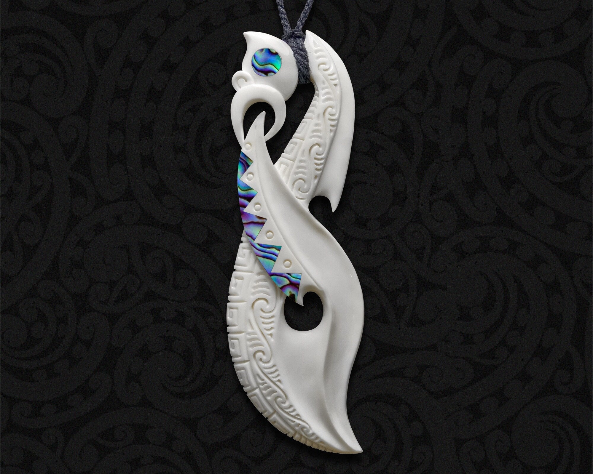 Sleek Maori Manaia Bone Pendant with Paua Shell Accents – Toa Bone