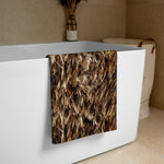 Māori Kahu Huruhuru Beach Towel draped over a white bathtub in a bathroom setting