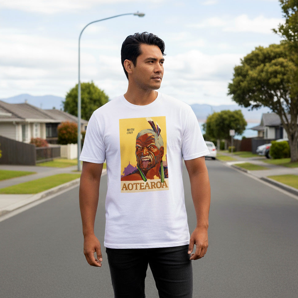 Man wearing a maori t-shirt with a graphic design on a suburban street