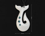 Hand-carved white bone whale tail fish hook pendant displayed against a black background with measurement graphic lines showing 80 mm length and 40 mm width.