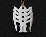 Hand-carved cattle bone pendant featuring a stylized frigate bird, inspired by the Melanesian Tema Breastplate