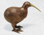Right-side view of the brass Kiwi sculpture, showing the detailed casting and golden metallic luster.