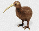 Profile view of the Large Brass Kiwi bird figurine looking to the left, highlighting its long bill and polished finish.
