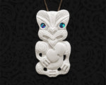 Hand-carved Maori Hei Tiki bone necklace pendant with intricate Kotiate detail