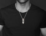 The Maori Taiaha pendant necklace on a model, showcasing its size and style