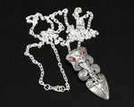 Side view of the silver Taiaha pendant highlighting the 'Tiramaka' warrior spirit design