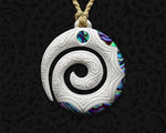 Hand-carved Maori Koru Bone Pendant from with Paua Shell Inlay