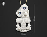 Front view of hand-carved Maori bone Tiki pendant necklace with measurements 