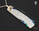 Maori Hei Toki necklace on an adjustable woven cord, showcasing its size