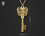 Detailed close-up of the intricate Maori Koruru carving on the Brass 21st Key pendant, showcasing its cultural significance