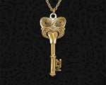 Front view of the Brass Maori 21st Key Pendant featuring a traditional Koruru carving and 'NZ' detail, exclusive to Tuwharetoa Bone