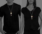 Person wearing the elegant New Zealand Maori 21st Key Brass Pendant, a meaningful gift for a 21st birthday
