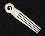 Hand-carved cattle bone Maori heru with a koru spiral design and paua shell accents