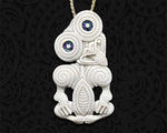 Front view of hand-carved Maori bone Tiki pendant necklace featuring a Ariki warrior pose 